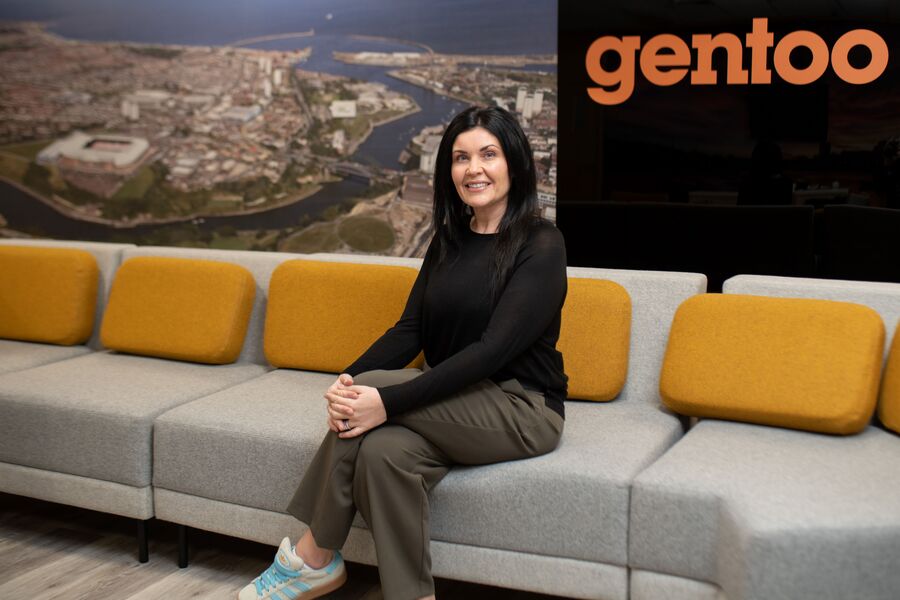 Nicola sitting on sofa in Gentoo office